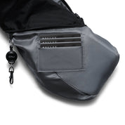 Close-up interior shot of Gray Shadow Grid FINO V Ultra-slim Tech Sling crossbody bag, built-in triple card pocket holding bank cards, detachable branded retractable key clip hook, smooth grey inner lining and waterproof exterior zipper compartment, detail showing multi-functional daily storage design on white background