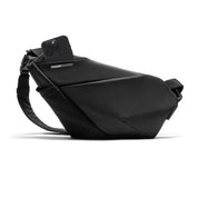 Front studio shot of Black Noir FINO V Ultra-slim Tech Sling crossbody bag, right-handed minimalist waterproof nylon chest pack with exterior phone slip pocket holding smartphone, geometric sleek anti-theft design for daily tech commute on plain white background