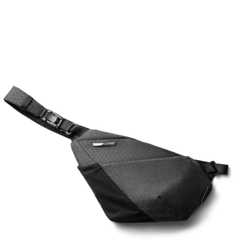 Top diagonal transparent cutout PNG of Gray Shadow Grid FINO V Ultra-slim Tech Sling crossbody bag, right-handed geometric textured nylon anti-theft chest fanny pack with full adjustable woven shoulder strap and plastic quick-release buckle, checkered transparent background, lightweight waterproof minimalist sling bag for daily tech storage and urban travel
