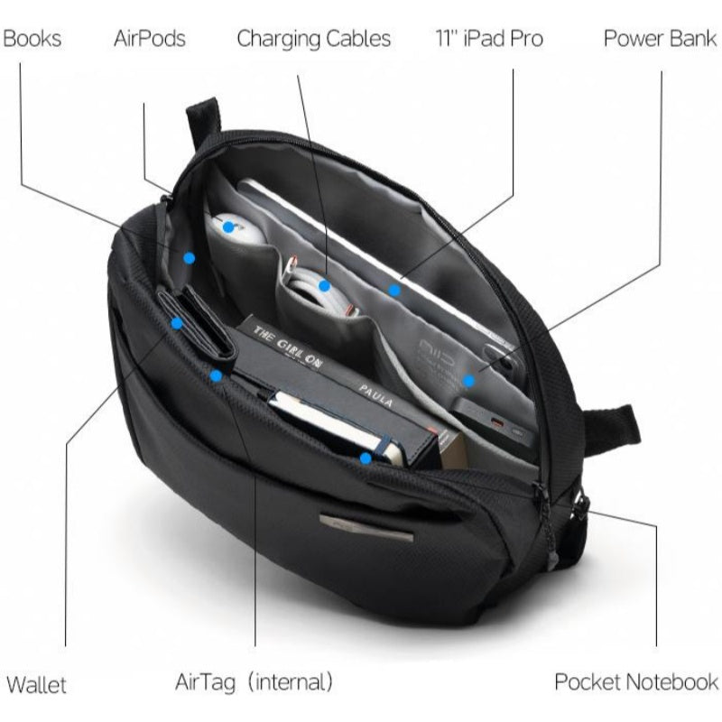 Open black NIID NEO Nomad 9L N2 sling bag interior storage diagram with labeled pockets for wallet, AirPods, charging cables, 11" iPad Pro, power bank, internal AirTag slot and pocket notebook