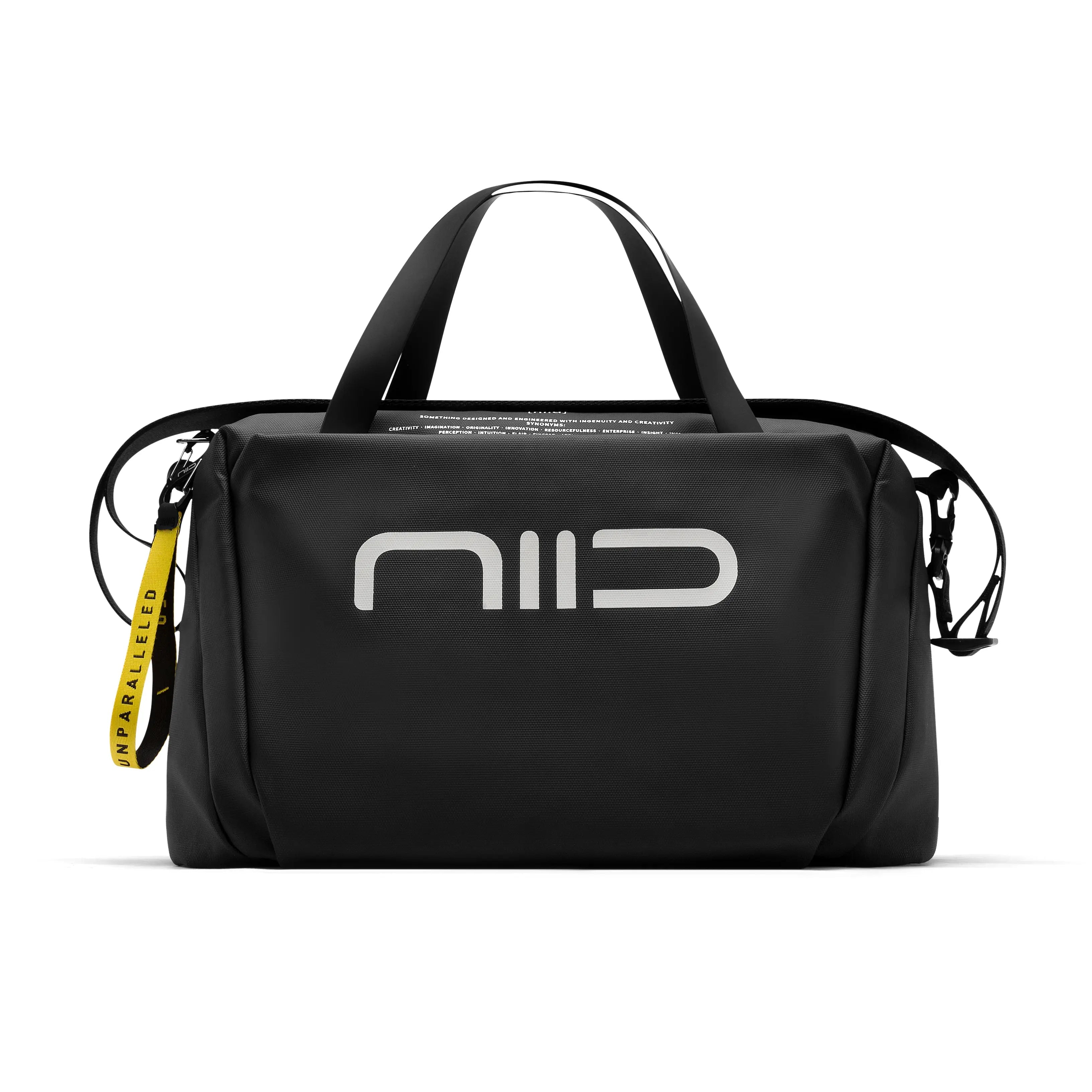 Front full view of black NIID S6 Hybrid Sling duffle crossbody bag with large white NIID logo, dual top handles, detachable shoulder strap and yellow branded zipper tag, studio shot on solid white background