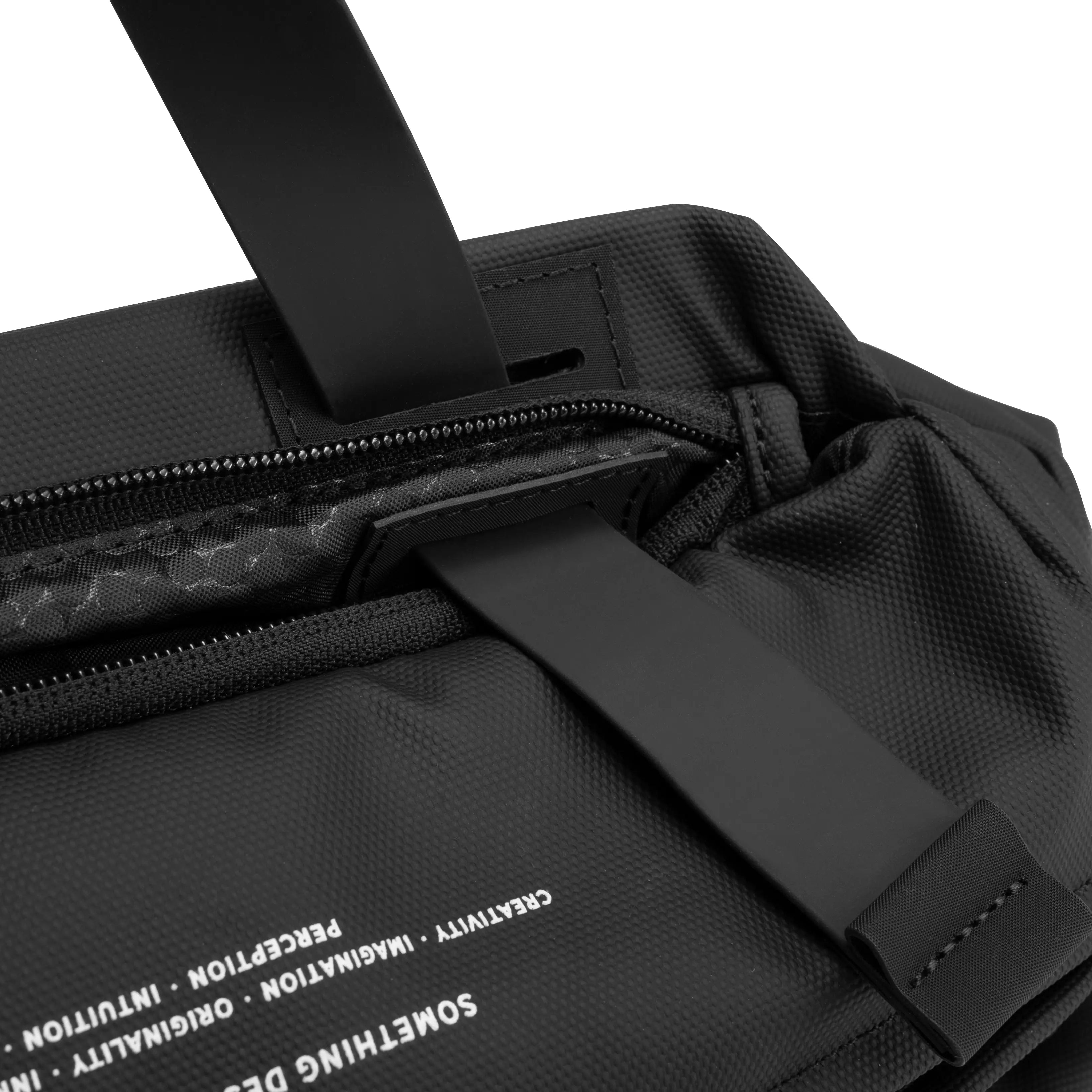 Close-up interior shot of black NIID S6 Hybrid Sling crossbody bag, zipper pocket storing leather wallet with smartphone, white NIID logo lining, clean white background