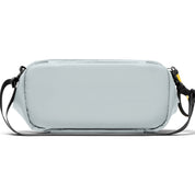Back view detail shot of gray NIID S6 Hybrid Sling crossbody bag, equipped with black adjustable shoulder strap and yellow branded zipper pull tab, plain white background rear structure display