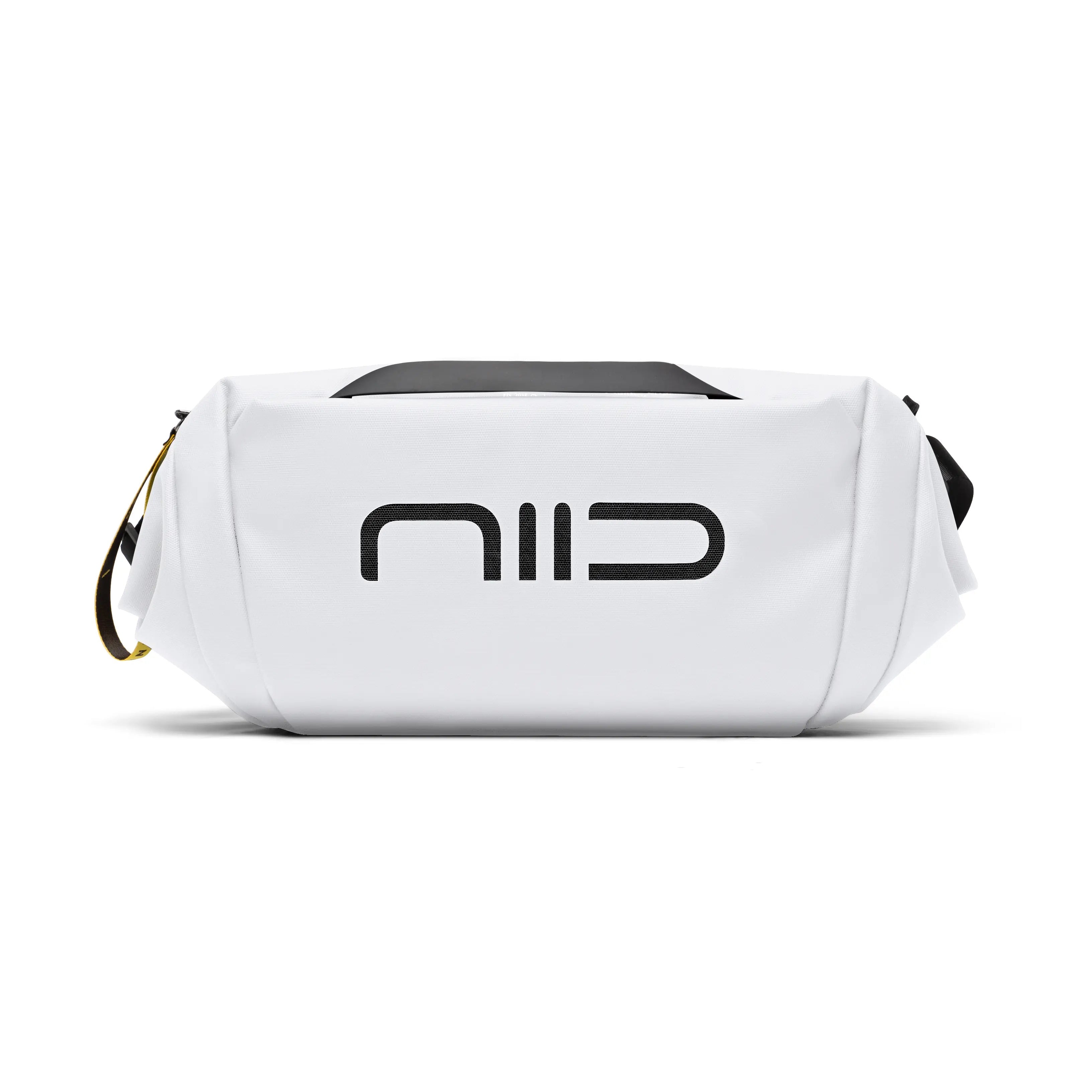 Side close-up view of white NIID S6 Hybrid Sling crossbody bag with bold black front logo, black top handle and yellow zipper tag, compact minimalist sling bag on clean white background
