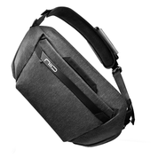NIID CACHE Hybrid Tech Sling in Dark, front angle product shot showing NIID logo and front zipper pocket, white background studio photo.