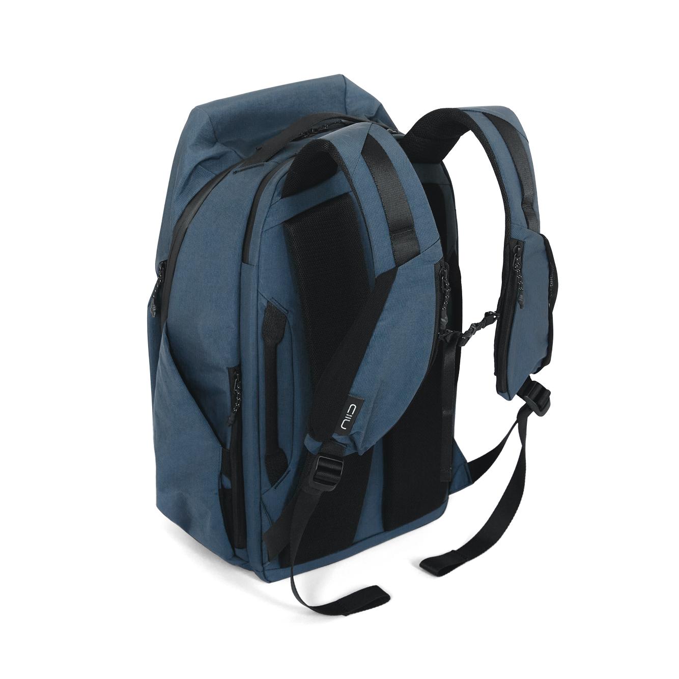 NIID NEO Nomad Backpack N4 in Prussian Blue, back view showing shoulder straps, sternum strap and quick-access side pockets.