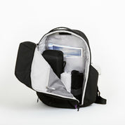 NIID NEO Nomad 30-32L Backpack N4 in Roman Black open clamshell, main compartment packed with magazine, pouch and folded clothes, travel capacity shot.
