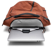 NIID NEO Nomad Backpack N4 in Venetian Red open showing padded laptop sleeve with laptop and tablet inside.