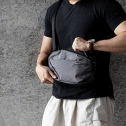 NIID NEO Nomad 4L Sling Bag‑N1 Graphite Gray unisex waterproof lightweight crossbody sling bag, front zipper opening demonstration, 4L everyday EDC chest bag