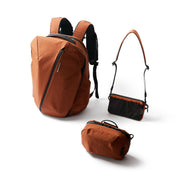 NIID NEO Nomad Backpack N4 bundle in Venetian Red showing backpack, Tech Pouch and Element Pouch with crossbody strap.
