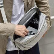 Open NIID N2 pearly gray sling bag inner compartment shot, camera gear storage demonstration
