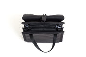 NIID NEO Nomad Pouch in Diamond Grid Black, front view standing closed showing drawstring clasp and bottom carry straps.