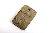 NIID NEO Nomad Pouch in Dune Tan Ripstop, angled front view closed showing drawstring clasp and NIID logo flap.