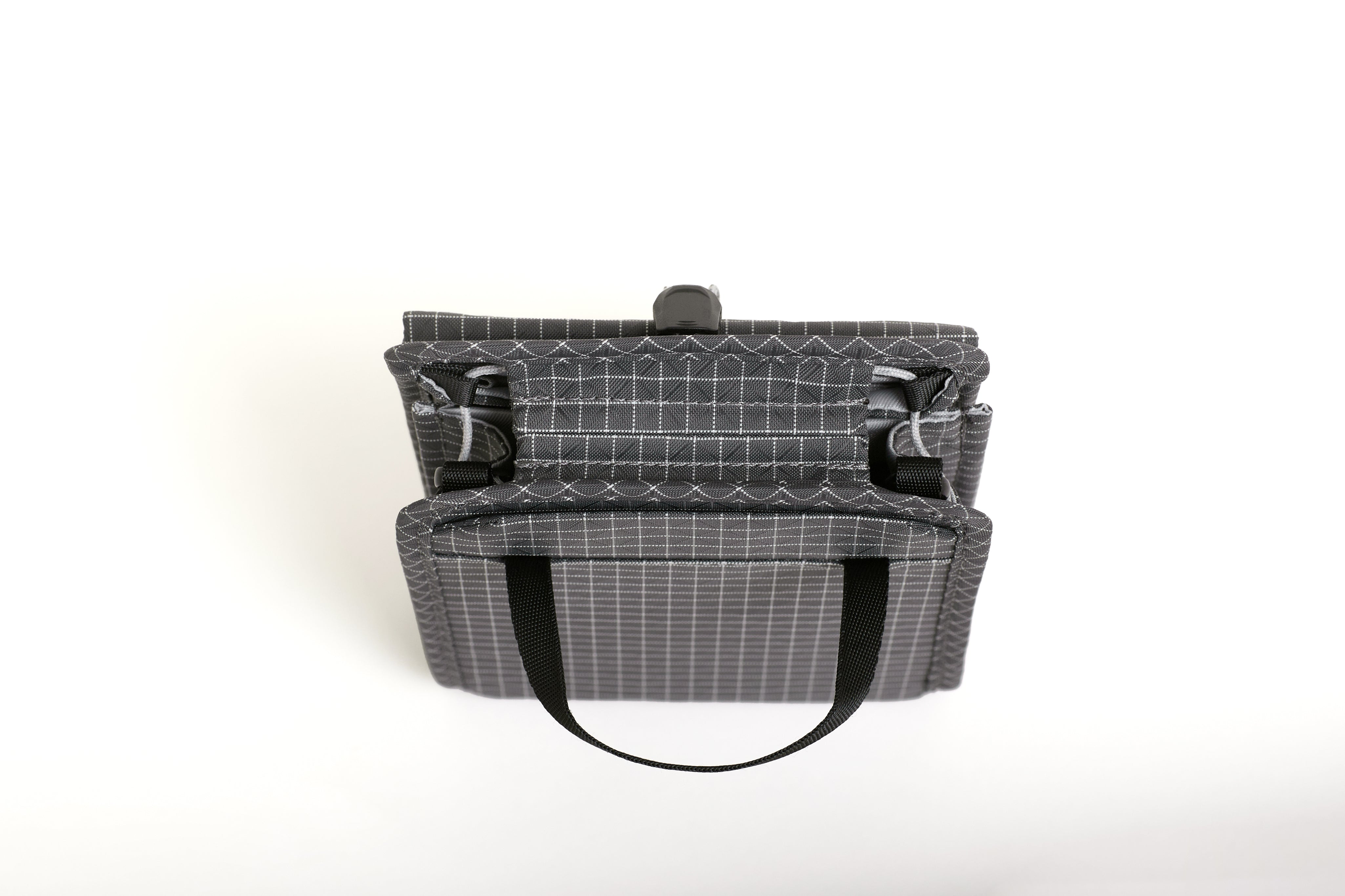 NIID NEO Nomad Pouch in Graphene Gray Ripstop, front view standing closed showing drawstring clasp and bottom carry straps.