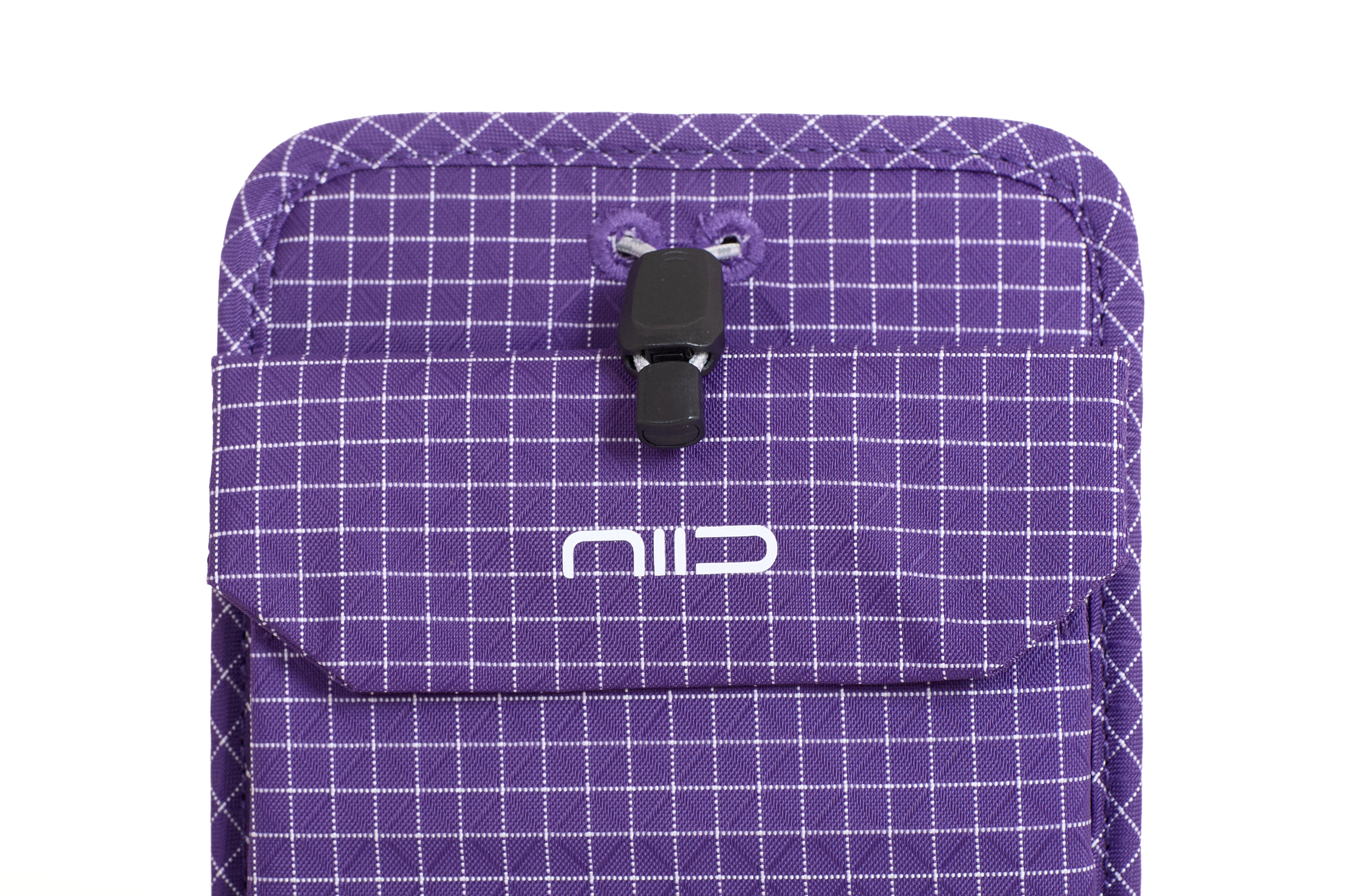Close-up of Nebula Purple Nomad Pouch front flap showing NIID logo, black drawstring cord lock and fabric eyelets.