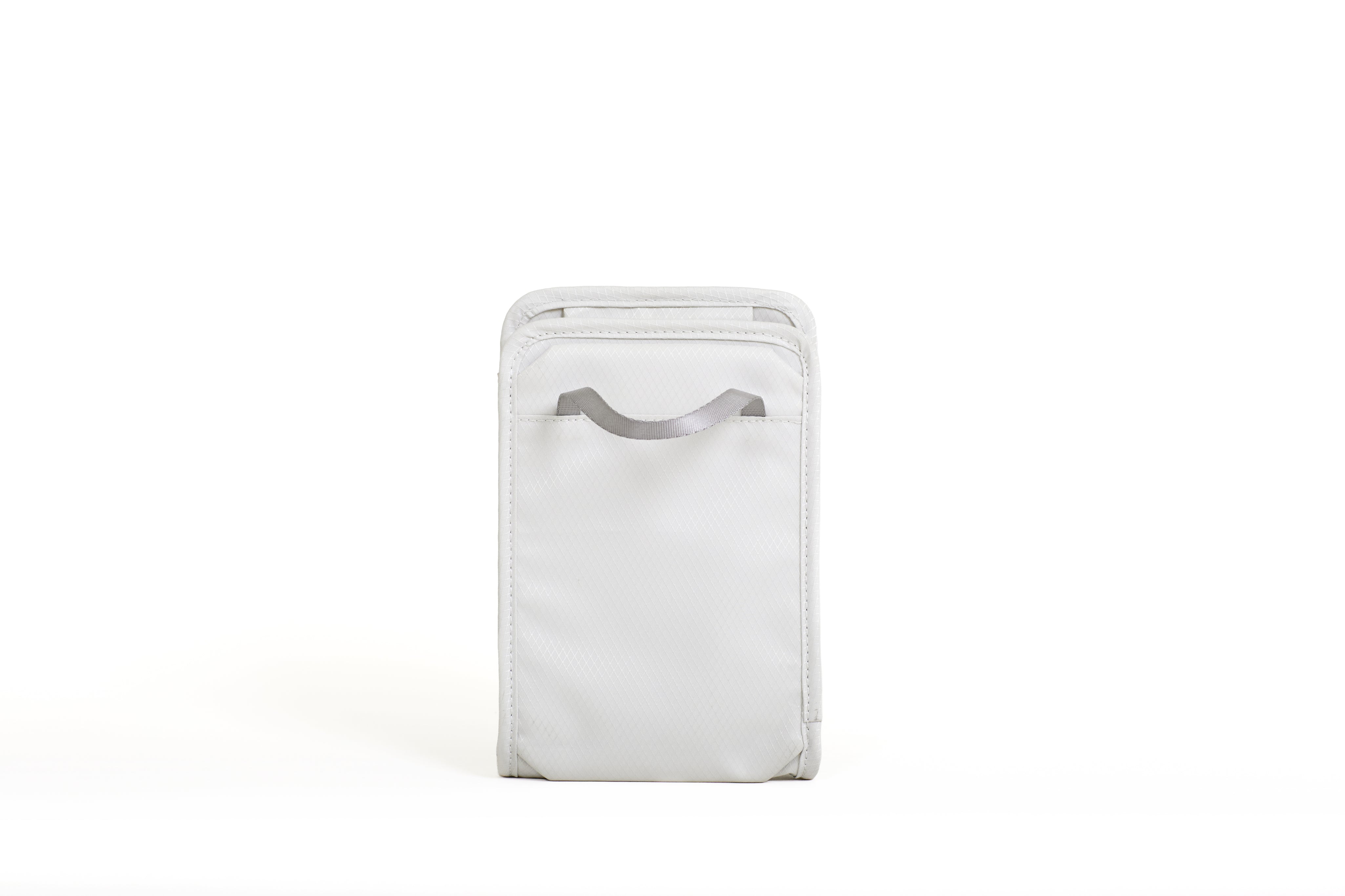 NIID NEO Nomad Pouch in Pearly White, back view standing showing smooth rear panel and top carry loop.