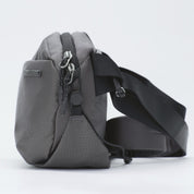 NIID NEO Nomad Sling Bag N1 Graphite Gray, grid textured waterproof crossbody chest pack, side profile shot with wide adjustable shoulder strap on plain white background
