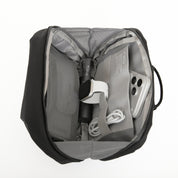 NIID NEO Tech Pouch in black open showing mesh compartments with smartwatch, phone, charging cable and bottle, travel organizer pouch.