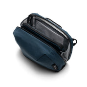 NIID NEO Tech Pouch in Prussian Blue open showing NIID branded lining and mesh side pockets, interior detail.