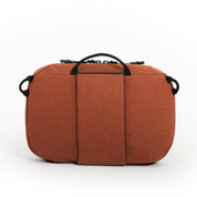 NIID NEO Tech Pouch in Venetian Red back view showing rear strap panel, top handle and side D-rings.