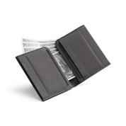 Open dark gray Nebula fabric NIID NEX slim bifold wallet on plain white background, card slots visible with US dollar bills tucked inside, inner fabric texture display of lightweight minimalist men’s EDC card holder