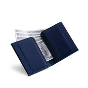 Open dark navy genuine leather NIID NEX slim bifold wallet on clean white background, layered card slots visible with US dollar bills stored inside, interior storage display of minimalist men’s everyday carry card wallet