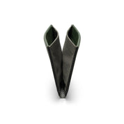V-shaped fully opened NIID NEX slim bifold wallet standing upright on plain white background, dark green genuine leather exterior paired with dark gray Nebula fabric interior, hollow open structure display of minimalist men’s card holder