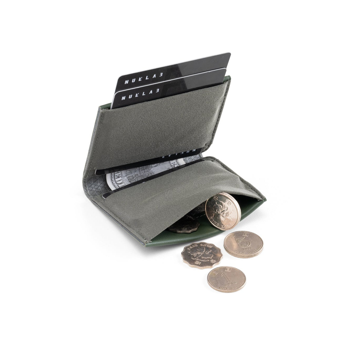 Open dark gray NIID NEX slim bifold wallet on plain white background, credit cards inserted in card slots, loose coins spilling out from built-in coin pocket, interior storage detail shot of minimalist men’s everyday carry wallet