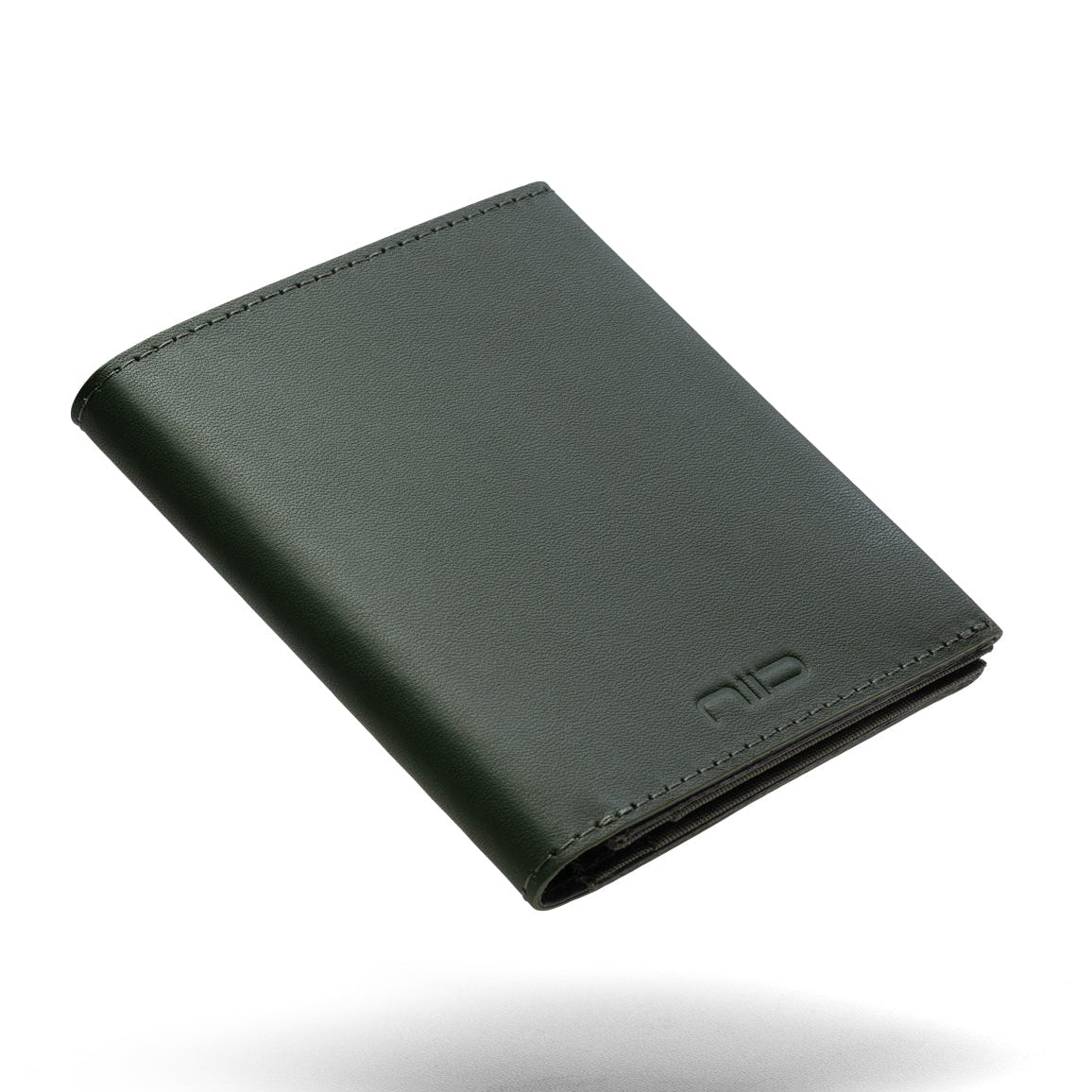 Dark green genuine leather NIID NEX slim bifold wallet floating on clean plain white background, subtle soft shadow underneath, embossed NIID logo on lower front, minimalist men's EDC card wallet product shot
