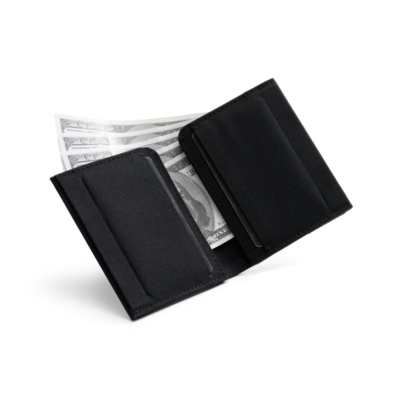 Open solid black Cordura fabric NIID NEX slim bifold wallet on clean plain white background, layered card slots with US dollar bills tucked inside, inner durable fabric storage display of minimalist men’s everyday carry card wallet