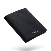 Floating angled shot of solid black smooth Cordura fabric NIID NEX slim bifold wallet on clean solid white background, silver embossed NIID logo on lower front corner, soft subtle shadow underneath, wear-resistant plain fabric minimalist men’s everyday carry card wallet product photography