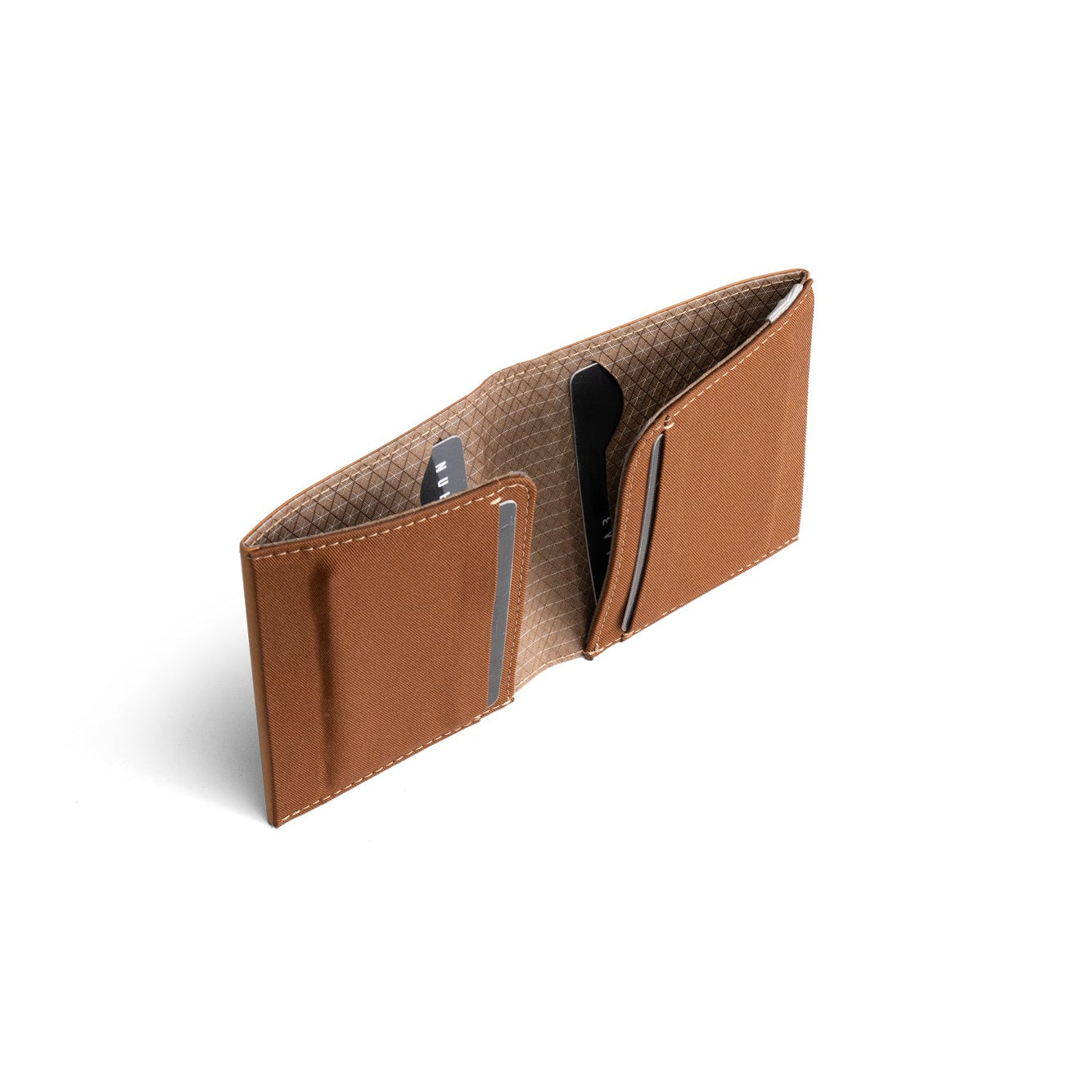 Open tan genuine leather NIID NEX slim bifold wallet standing upright on plain white background, grid patterned interior lining, multiple card slots with bank cards inserted, inner structure detail shot of vintage minimalist men’s EDC card holder