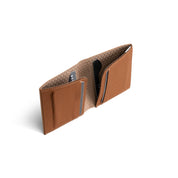 Open tan genuine leather NIID NEX slim bifold wallet standing upright on plain white background, grid patterned interior lining, multiple card slots with bank cards inserted, inner structure detail shot of vintage minimalist men’s EDC card holder
