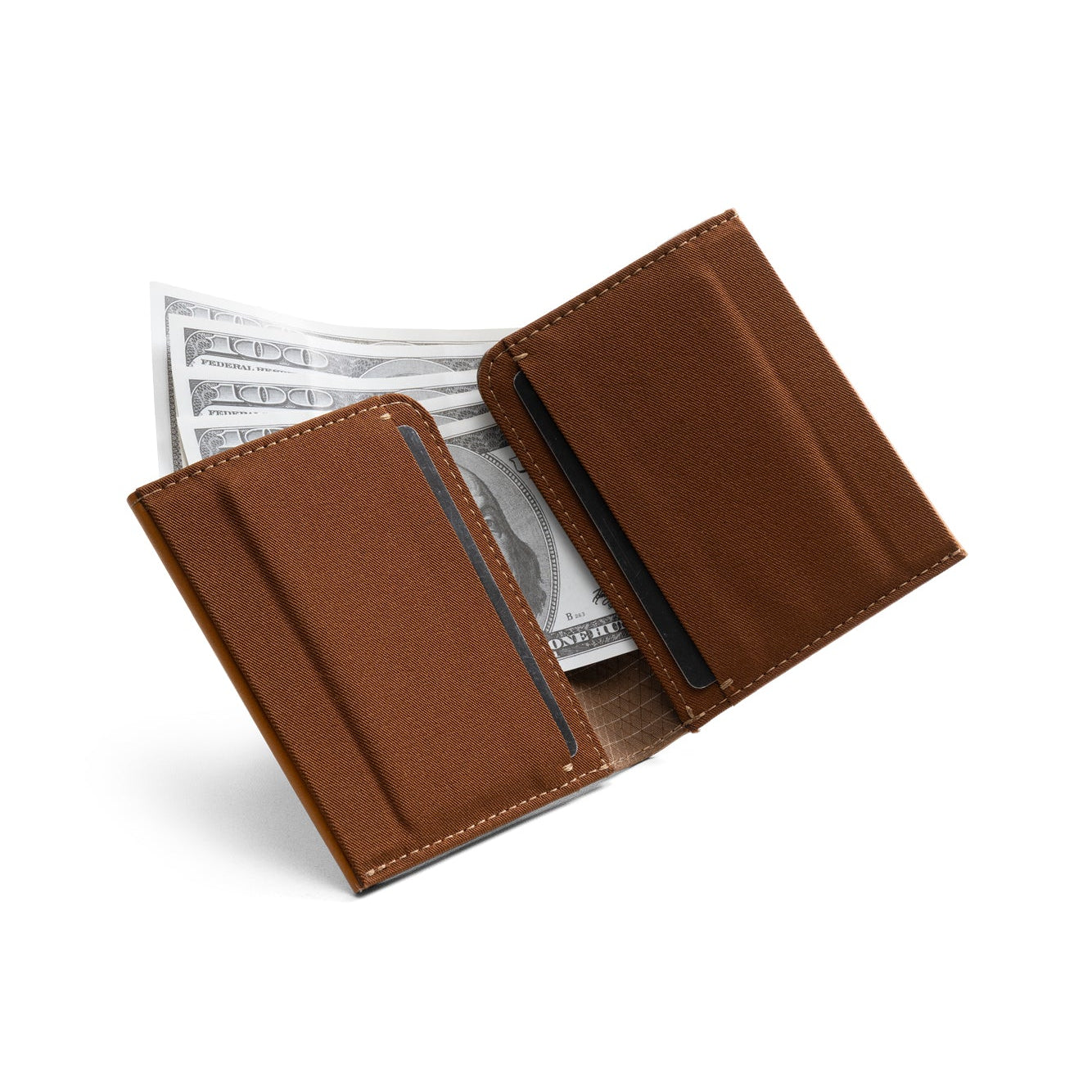 Open tan genuine leather NIID NEX slim bifold wallet on clean white background, grid fabric interior lining, card slots with US dollar bills tucked inside, interior cash storage display of vintage minimalist men’s EDC wallet