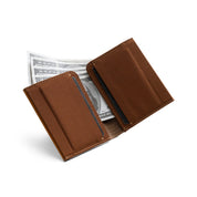 Open tan genuine leather NIID NEX slim bifold wallet on clean white background, grid fabric interior lining, card slots with US dollar bills tucked inside, interior cash storage display of vintage minimalist men’s EDC wallet