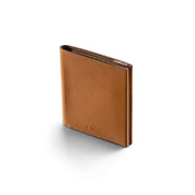 Upright standing shot of tan smooth genuine leather NIID NEX slim bifold wallet on clean plain white background, neat fine edge stitching, embossed NIID logo on lower front, soft subtle shadow, minimalist vintage men’s daily carry card holder product photo