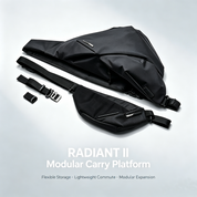 Studio product photo of black NIID Radiant II modular sling bag full set including main bag, detachable wing pocket and adjustable strap hardware on light gray background, text Radiant II Modular Carry Platform with feature tags Flexible Storage Lightweight Commute Modular Expansion