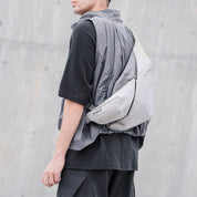 NIID Radiant R2 Everyday Sling Bag Diamond Grid Gray modular crossbody sling bag, side‑back wearing view, urban commuter EDC tech sling bag