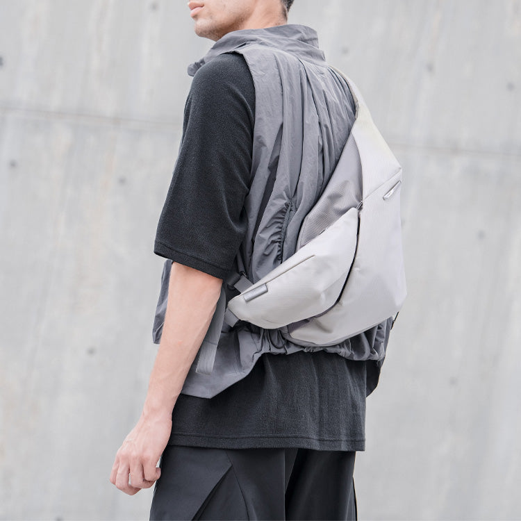 NIID Radiant R2 Everyday Sling Bag Diamond Grid Gray modular crossbody sling bag, side‑back wearing view, urban commuter EDC tech sling bag