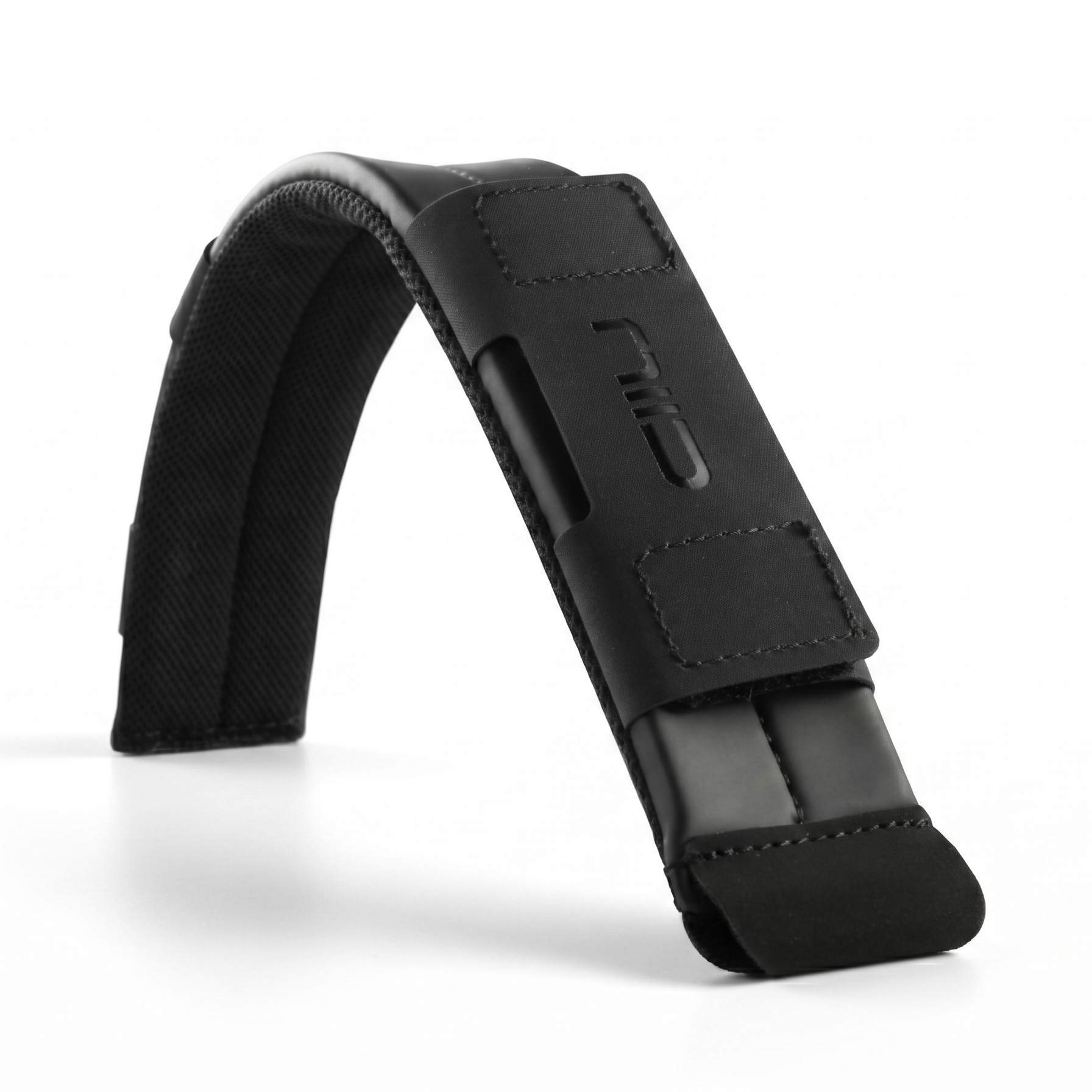 NIID black ergonomic shoulder pad close-up, padded breathable polyester shoulder strap accessory with embossed NIID logo, white background product photography for sling bags and camera straps