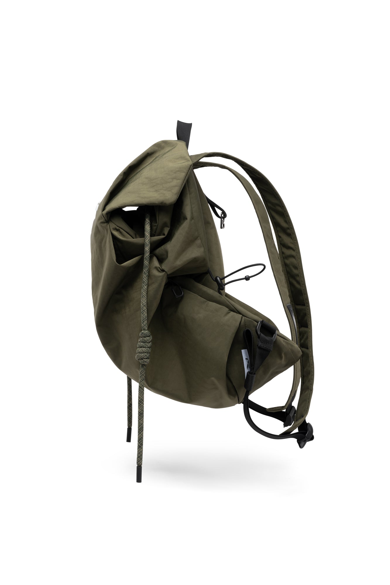 Three-quarter side full product shot of olive green NIID VIA roll-top backpack, showcasing thick drawstring cord, multi exterior zipper pockets and adjustable full shoulder straps for daily commute and casual outdoor use