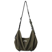 NIID VIA dual-purpose gym duffle bag olive green slouch crossbody shoulder bag, woven knotted adjustable strap, white NIID logo on front, white background studio product photo