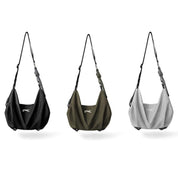 Three‑color options of NIID VIA Gym Bag, black, olive green and cool gray slouchy shoulder bags on plain‑white background