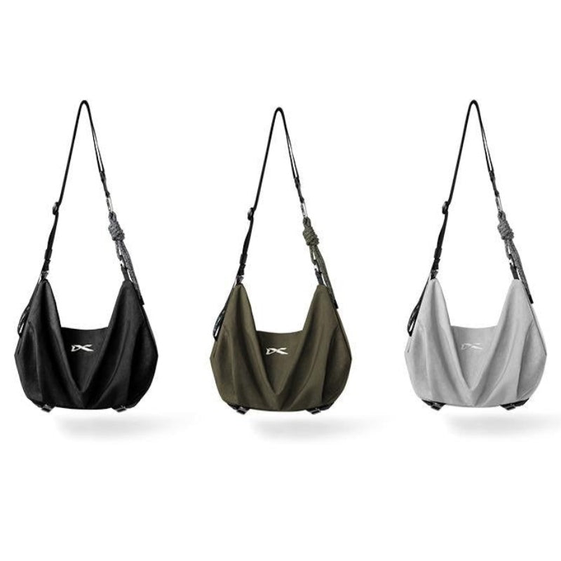 Three‑color options of NIID VIA Gym Bag, black, olive green and cool gray slouchy shoulder bags on plain‑white background
