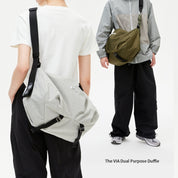 Two‑model showcase for NIID VIA Gym Bag in light‑grey and olive‑green, white plain studio backdrop