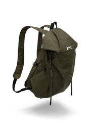 Floating studio product photo of olive green NIID VIA roll-top backpack with subtle soft shadow, featuring iconic white NIID logo on front flap, thick braided drawstring closure and adjustable padded shoulder straps for daily travel and casual outdoor trips