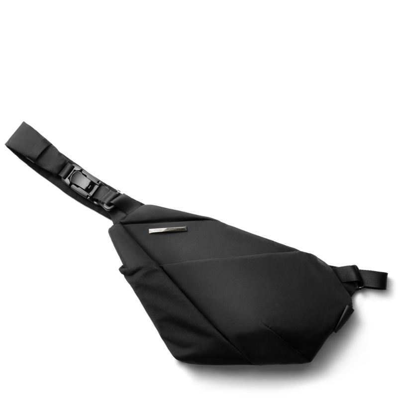 NIID FINO V ultra-slim tech sling Black Noir side profile view, geometric folded structured crossbody chest bag, adjustable comfort shoulder strap, water-resistant lightweight fabric for minimalist urban daily carry