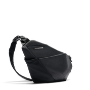 NIID FINO V ultra-slim tech sling Black Noir side profile view, geometric folded structured crossbody chest bag, adjustable comfort shoulder strap, water-resistant lightweight fabric for minimalist urban daily carry