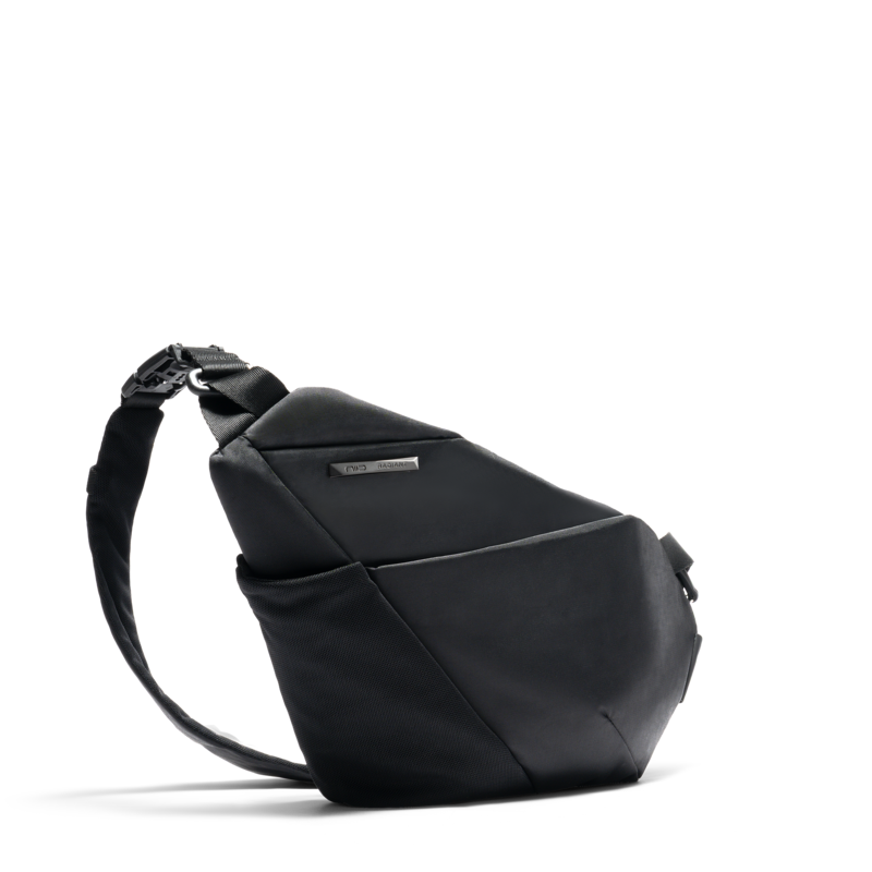 NIID FINO V ultra-slim tech sling Black Noir side profile view, geometric folded structured crossbody chest bag, adjustable comfort shoulder strap, water-resistant lightweight fabric for minimalist urban daily carry
