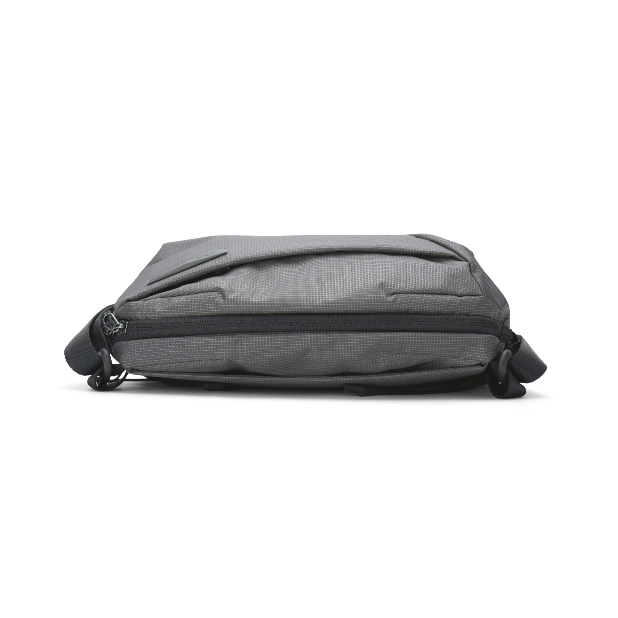 NIID N1 sling bag front exterior overview, made of durable diamond grid nylon fabric with smooth waterproof zipper.